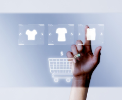 Person adding clothes to cart closeup for online shopping campaign